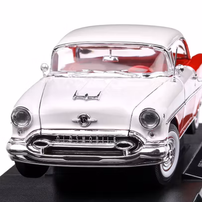Macheta auto Oldsmobile Super 88 Convertible 1955 scara 1:18 rosu cu alb Welly