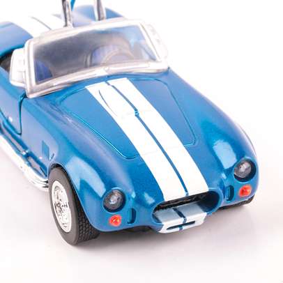 Macheta auto Shelby Cobra 427 1966 bleu cu alb scara 1:32 New Ray - vedere 3/4 dreapta fata close up